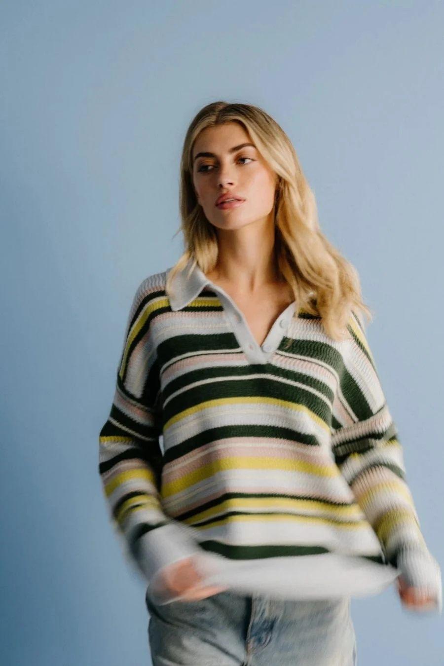 Model in green and cream striped sweater, Sablyn spotlight