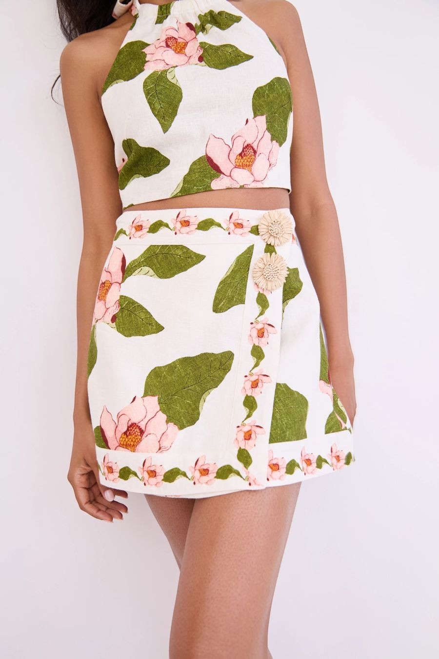 Bunny and Babe Winnetka Fischer mini wrap skirt in ivory linen with pink floral print and raffia trim.